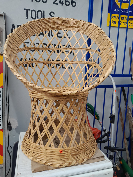 Eco-friendly handwoven bamboo chair, perfect for relaxing on your patio or lounge. Pre-owned and available at Die Skatkis.