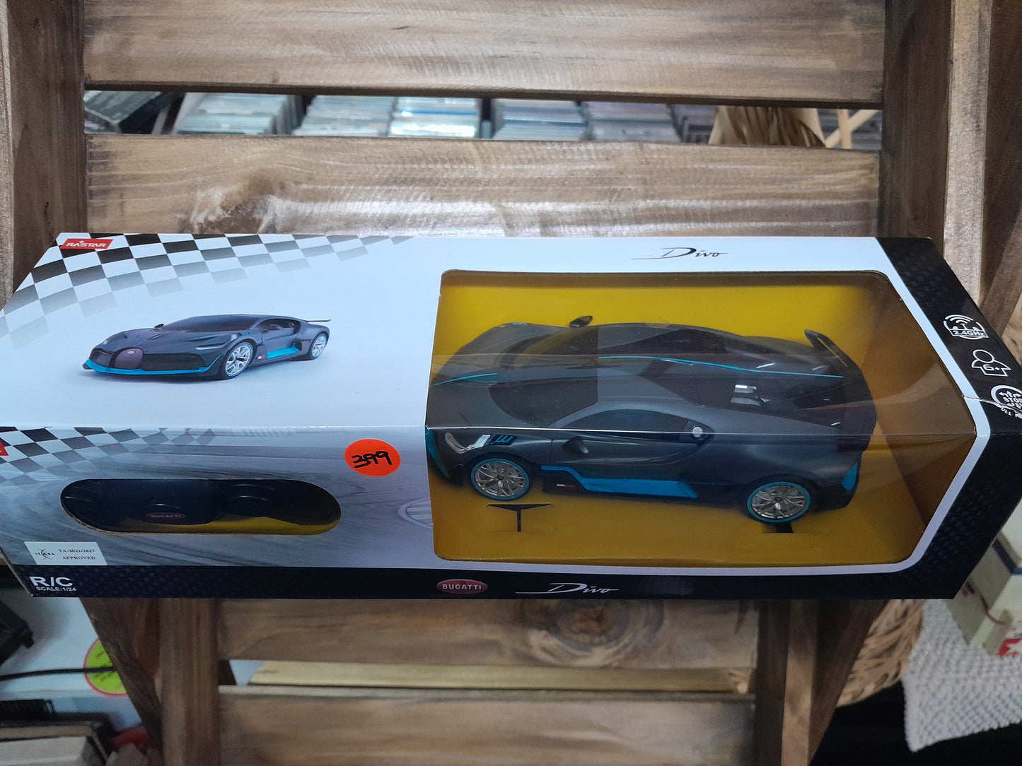 Boxed Rastar Bugatti Divo RC Car, 1/24 scale with detailed grey and blue design, visible through clear window, available at Die Skatkis.