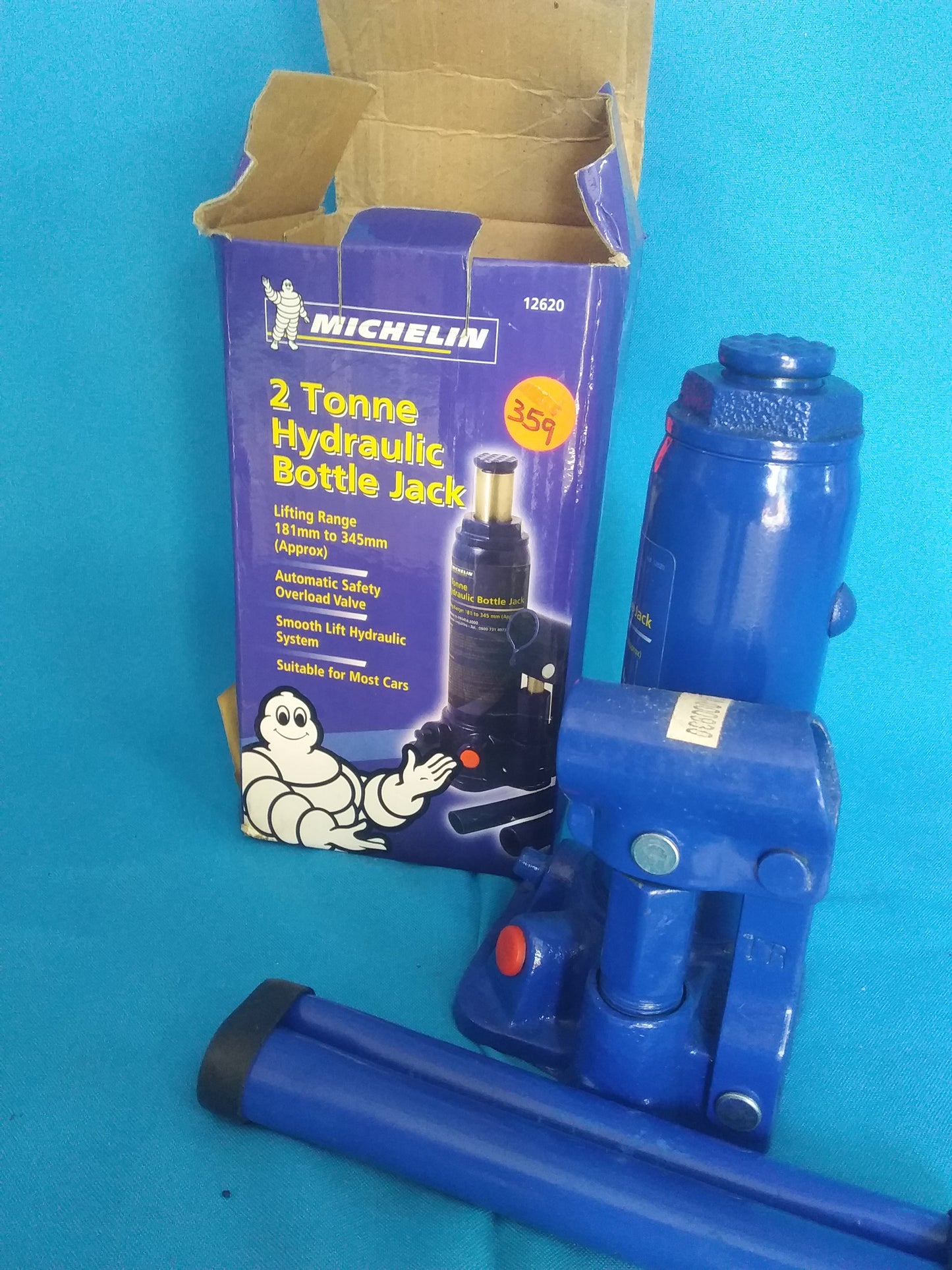 "Michelin 2 Tonne Hydraulic Bottle Jack with lifting range 181mm to 345mm, shown with blue jack and purple box featuring the Michelin logo and mascot.