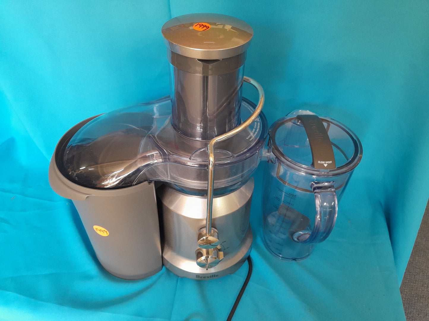 Breville Centrifugal Juicer BJE430, 1050-1250W, with titanium blade, safety locking arm, and dishwasher safe parts.