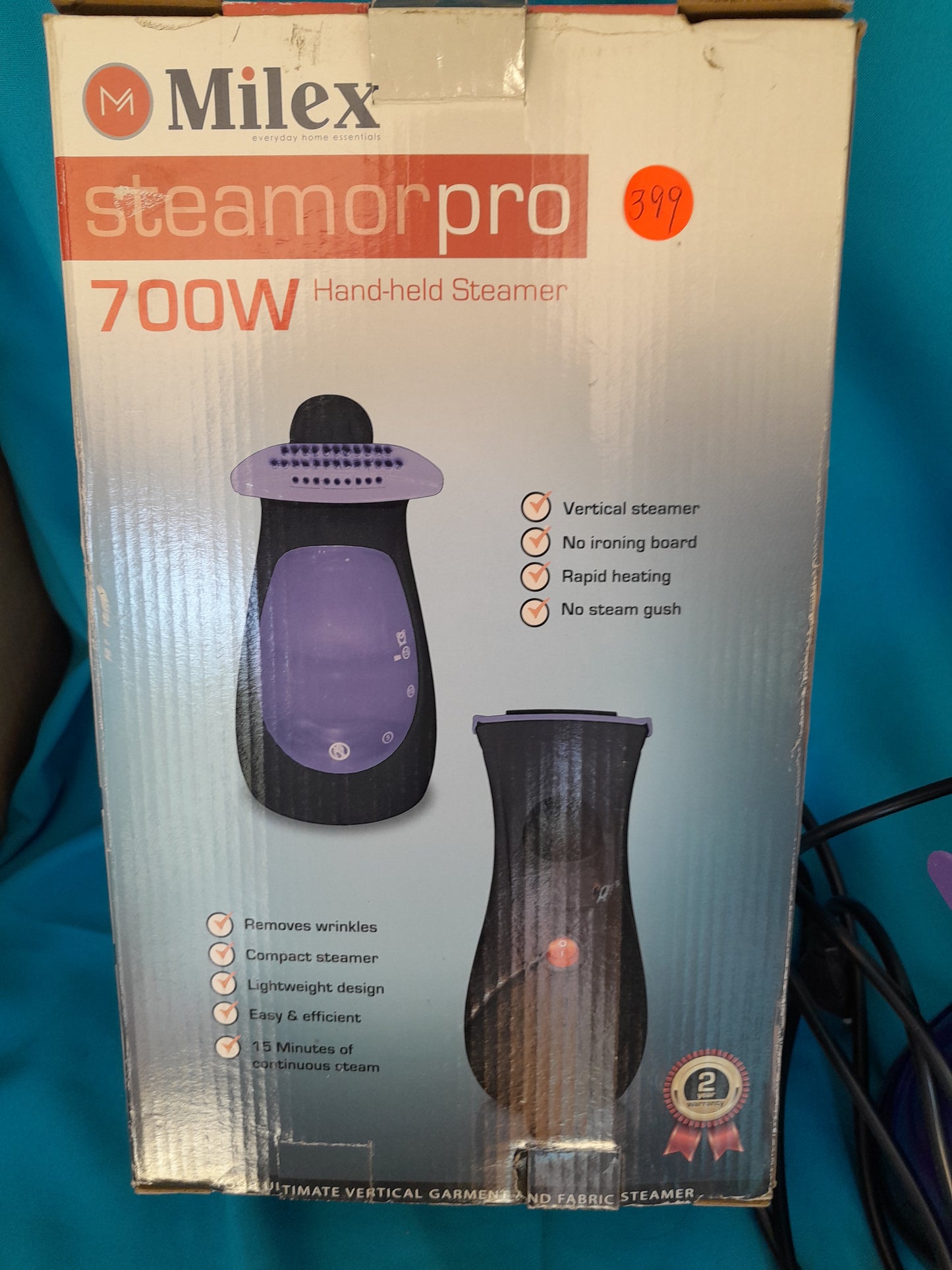 Milex Steamorpro 700W Handheld Steamer in original packaging highlighting features like rapid heating and lightweight design.