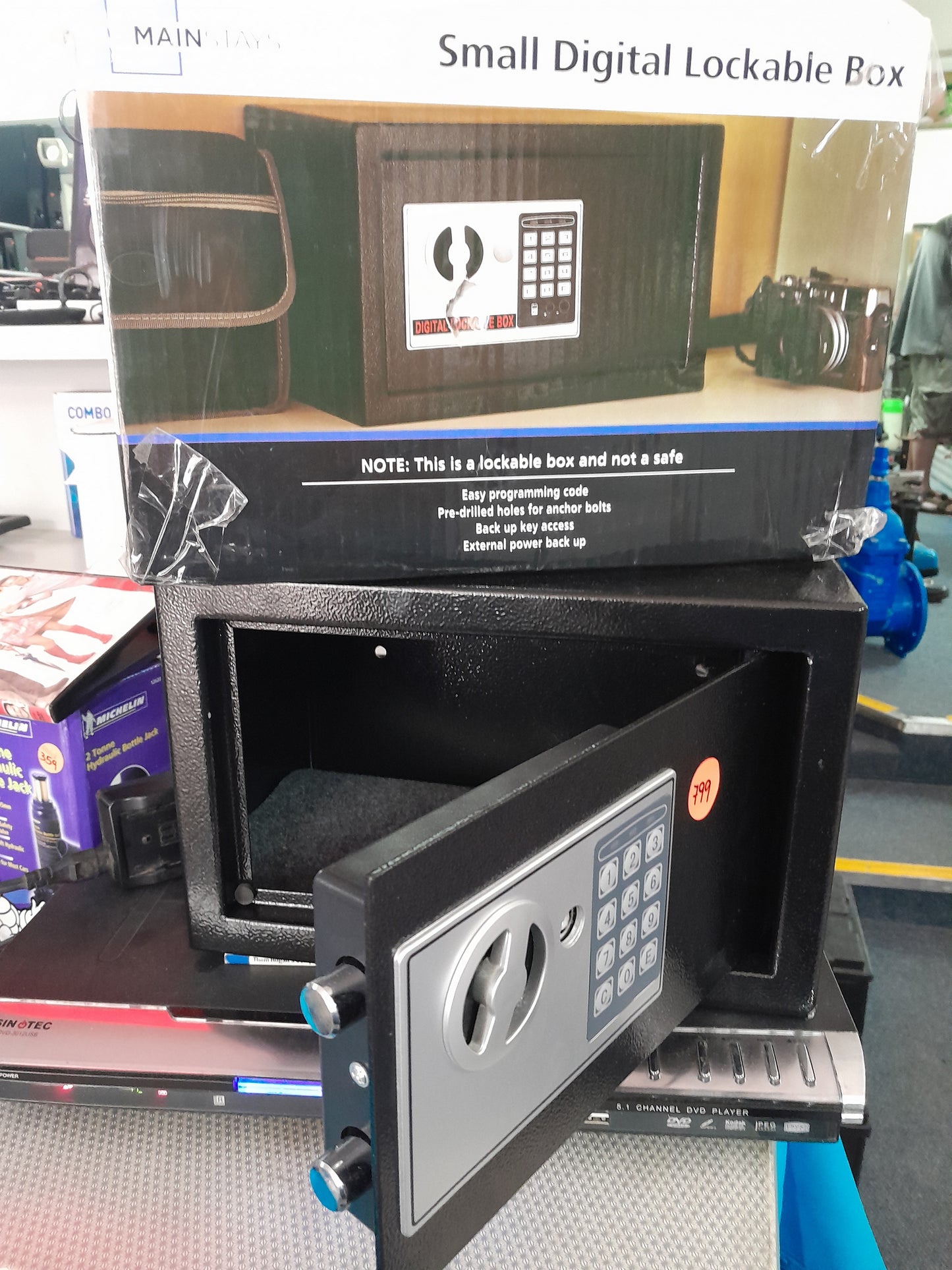 Mainstays small digital lockable box displayed in a secondhand store environment.