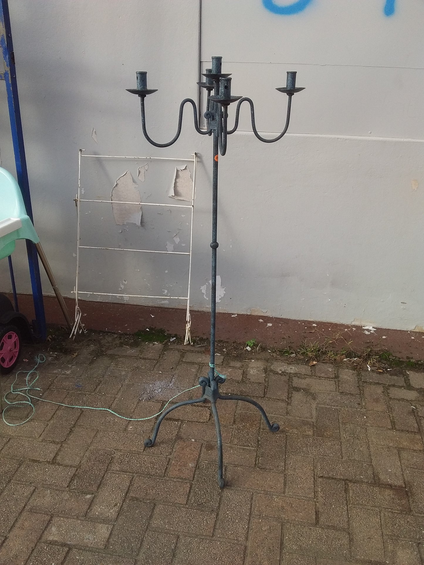 Rustic steel 5-candle holder with weathered appearance, perfect for vintage décor, available at Die Skatkis secondhand store.