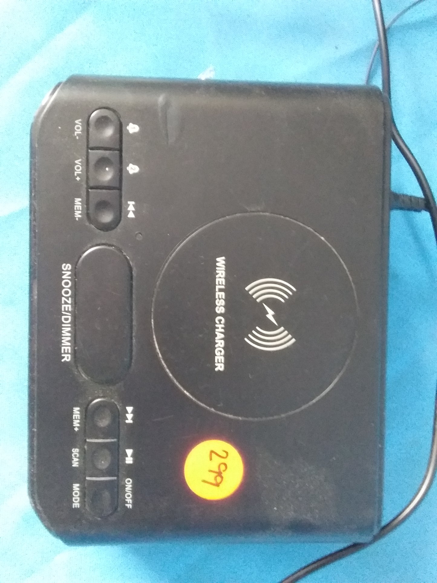 Telefunken Bluetooth clock radio with wireless charging area in the center, multiple control buttons, and sleek black design. Available at Die Skatkis.