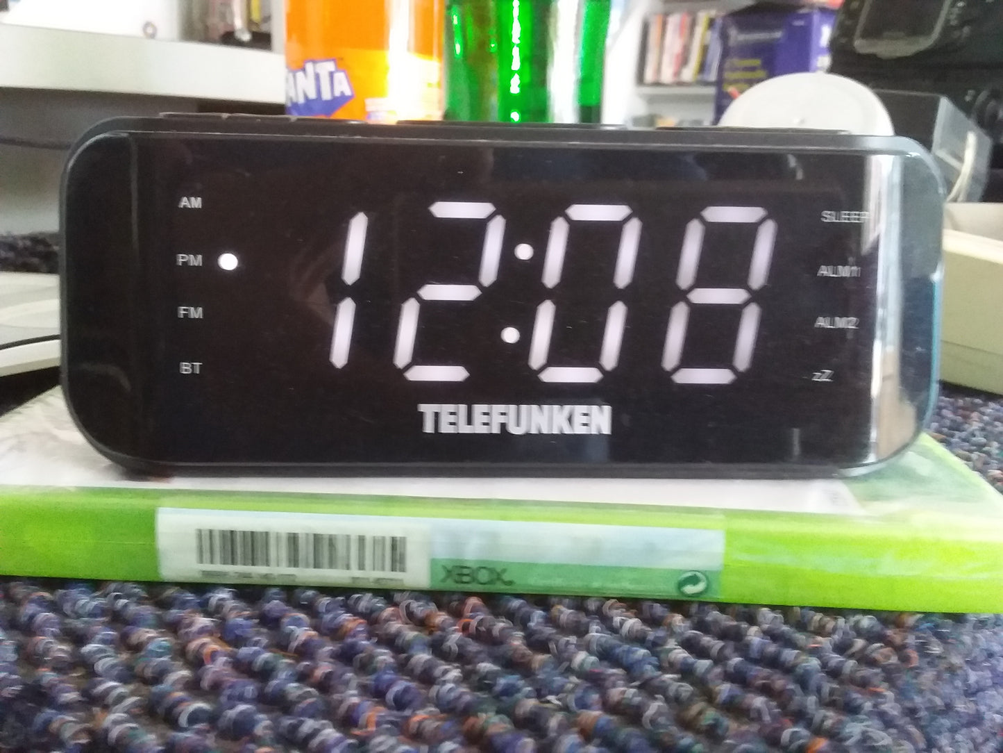 "Telefunken digital clock radio showing time 12:08 with multiple indicators like AM, FM, BT. Available at Die Skatkis.