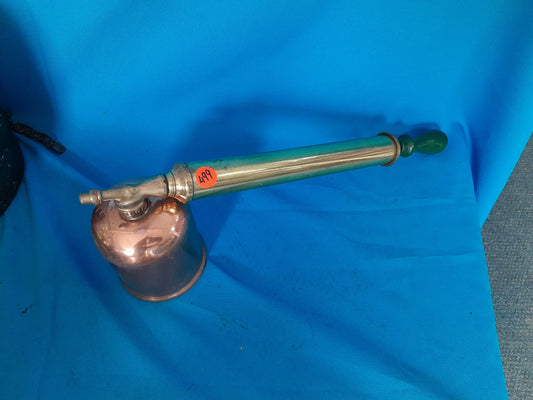 Well-preserved vintage hand pressure pump sprayer, suitable for spraying pesticides in gardens.