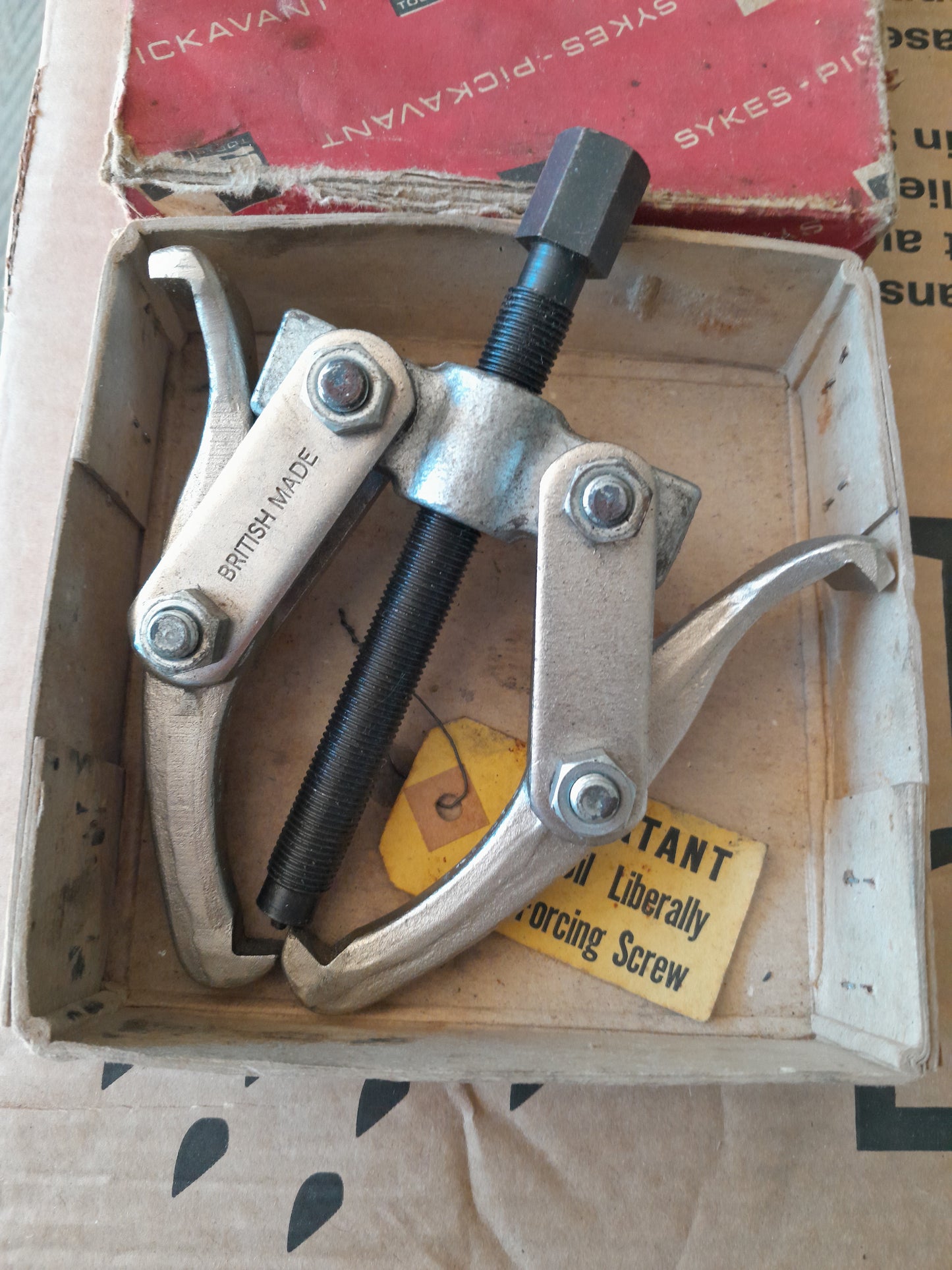 Vintage Sykes-Pickavant twin grip gear puller, complete with original packaging, great for collectors.