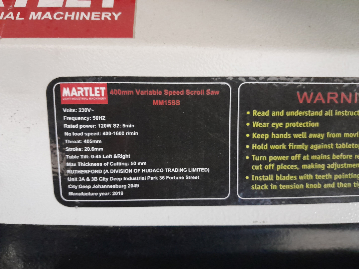 Close-up of Martlet MM15SS label detailing power specifications and cutting capabilities for woodworking enthusiasts.