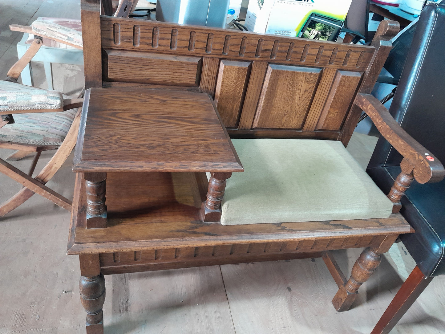 Beautifully crafted wooden telephone table with a seat, a timeless piece for any vintage furniture collection.