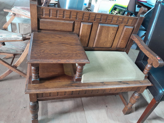 Beautifully crafted wooden telephone table with a seat, a timeless piece for any vintage furniture collection.