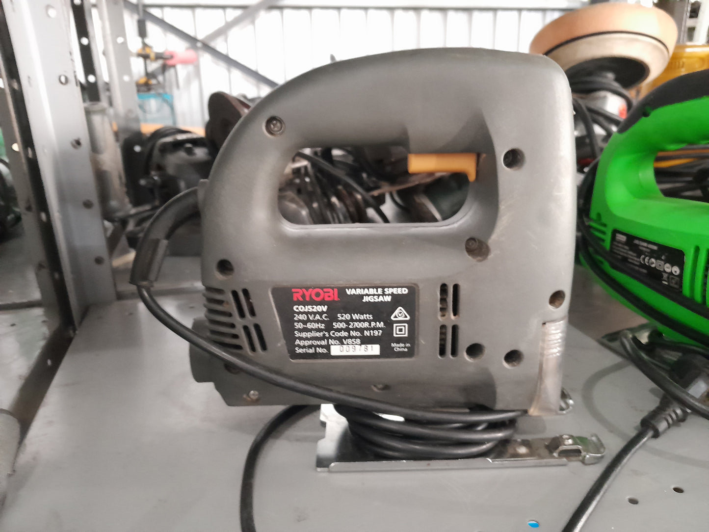 Ryobi jigsaw on display, featuring a 520W motor and ergonomic design for comfortable use.