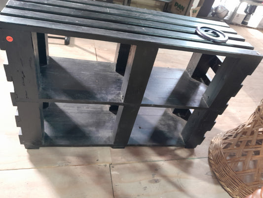 Versatile black wooden TV stand with a robust construction, suitable for any living room setup.