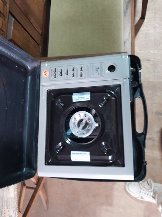 Bush Baby camping stove in use outdoors, demonstrating its convenience for camping meals.