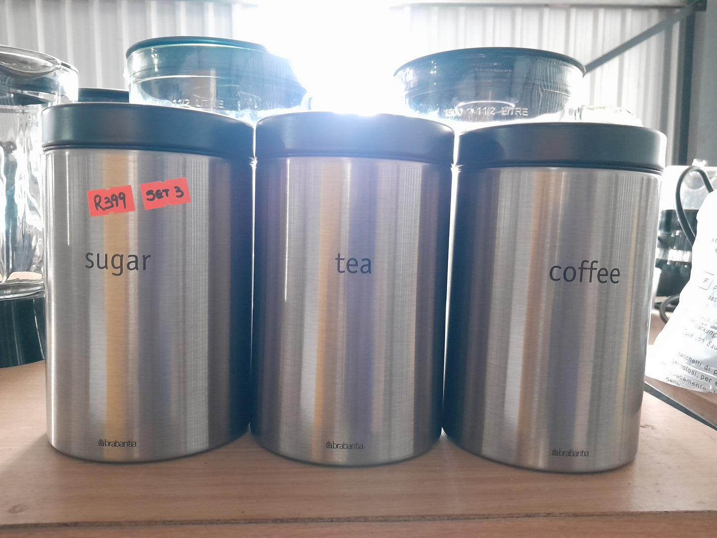 Set of three Brabantia canisters made of matte steel for coffee, sugar, and tea, ideal for any kitchen.