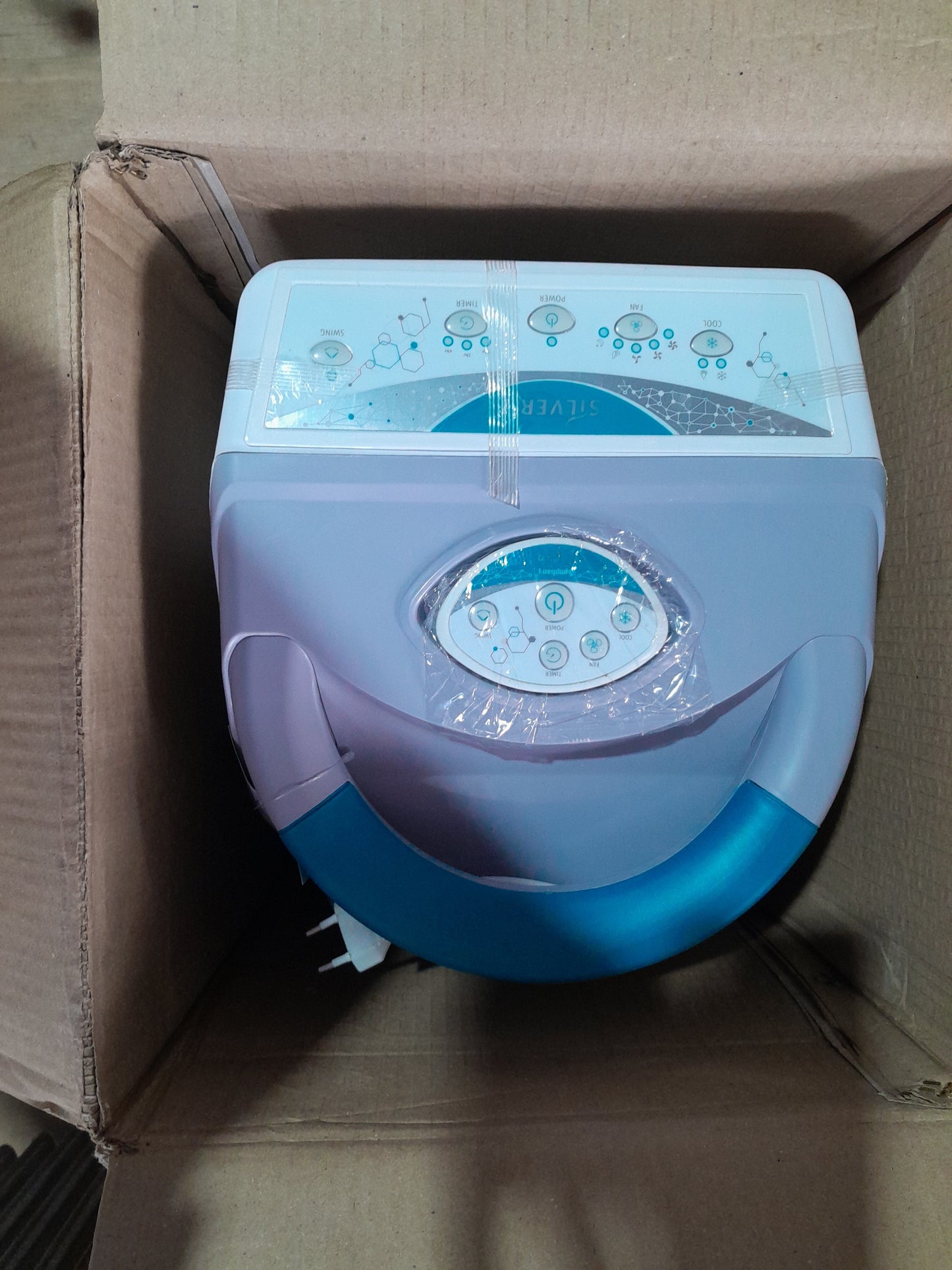 Symphony Evaporative Air Cooler packed in a box, ideal for energy-efficient cooling.