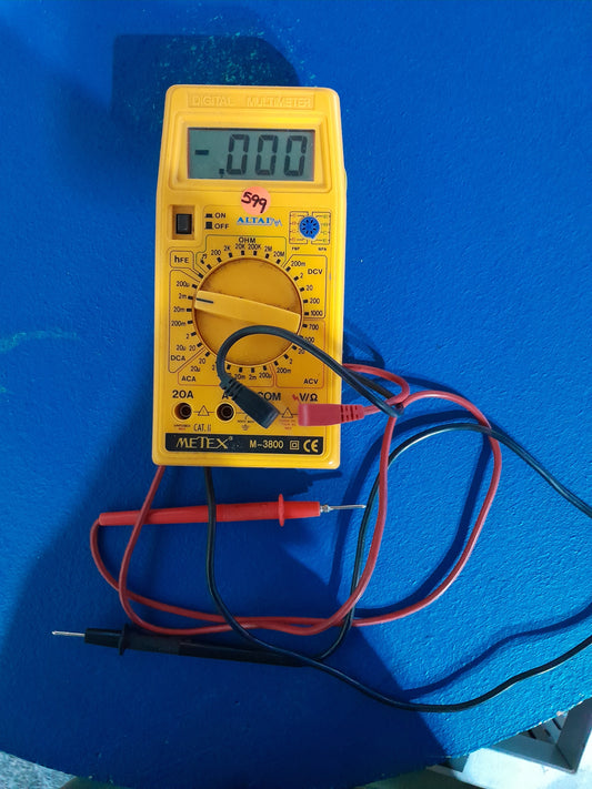 Altai Metex M-3800 digital multimeter measuring voltage and current with test leads.