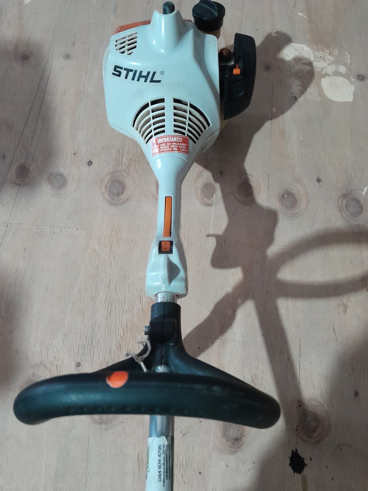 Angled view of Stihl FS38 petrol weed eater, showcasing its design for effective weed control.
