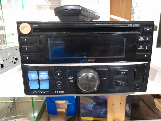 Front view of Alpine CDE-W233R car stereo with USB port and control buttons.