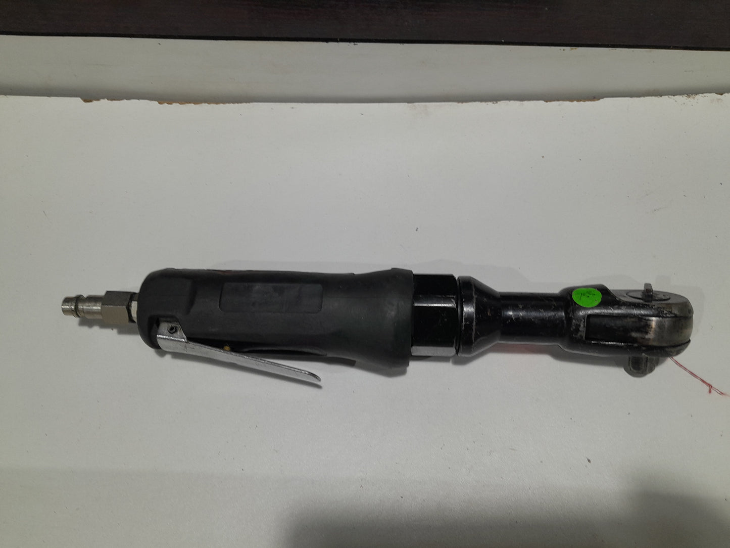 Lightweight pneumatic air ratchet wrench designed for maximum torque and efficiency.