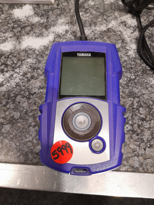Yamaha Power Tuner device for optimizing motorcycle engine settings and performance.