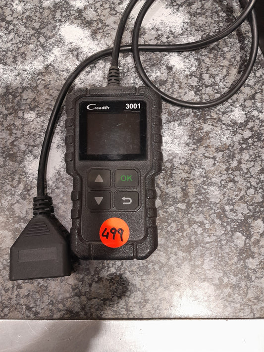 Creader 3001 OBD2 scanner on a countertop, ideal for diagnosing car issues.