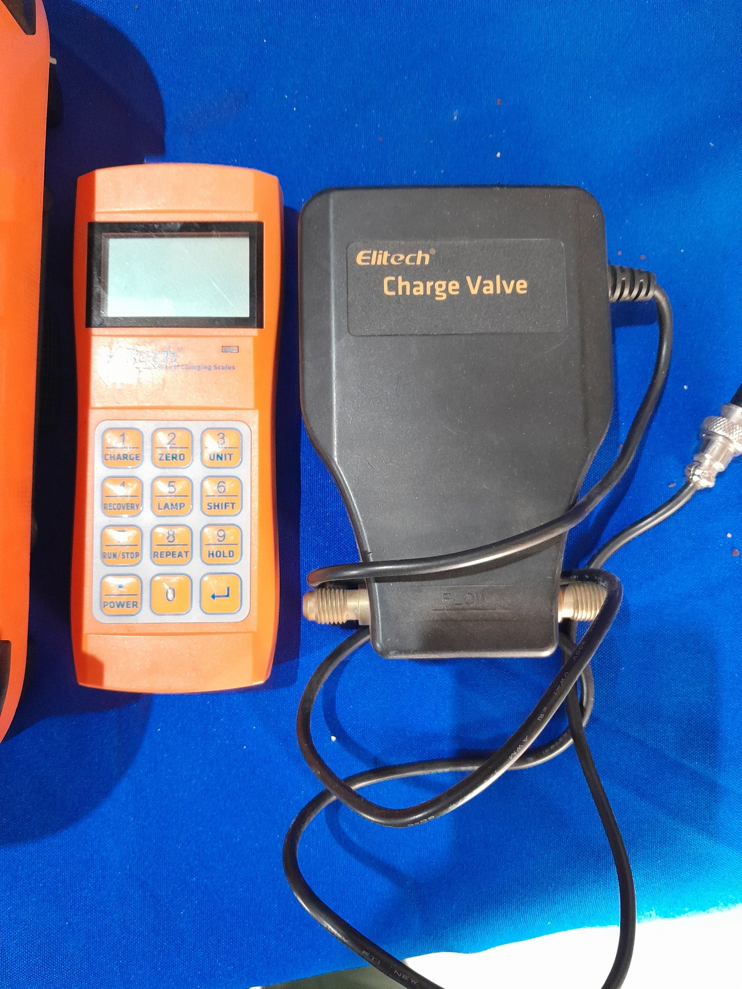 Complete Elitech LMC-200 refrigerant scale setup including control panel and charge valve for easy use.