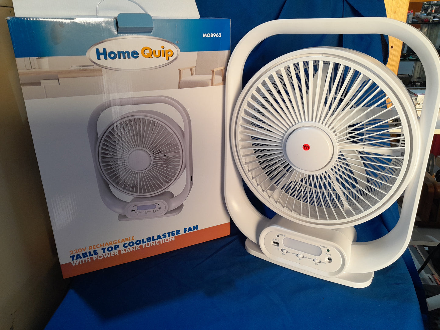 HomeQuip rechargeable fan packaging showcasing its tabletop design and power bank capability.
