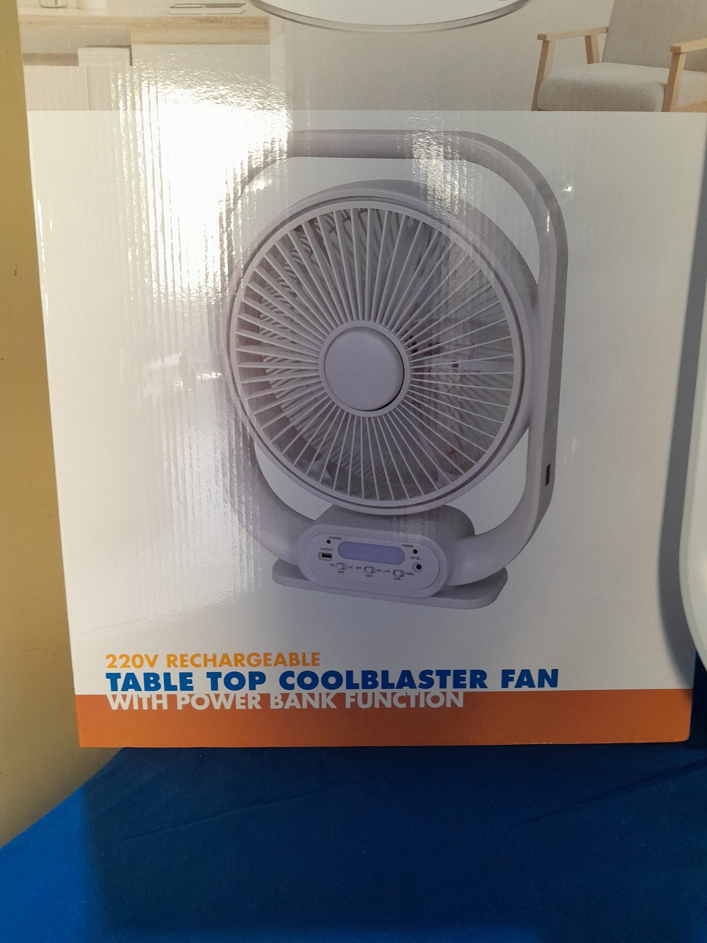 HomeQuip 220V rechargeable tabletop fan with power bank function and USB charging port.