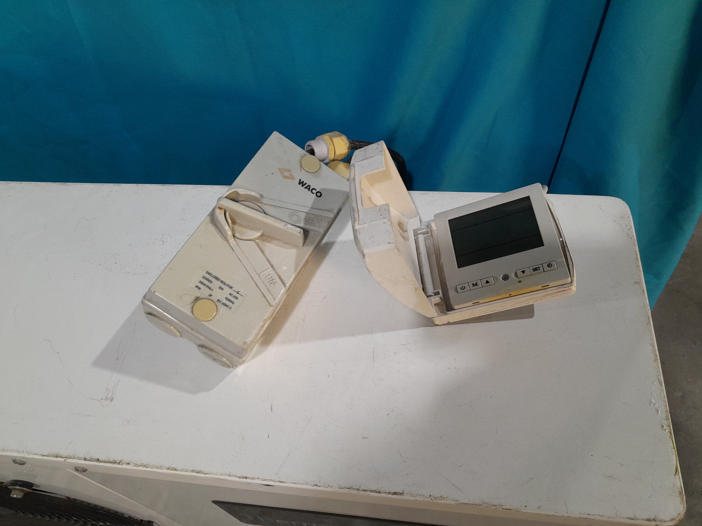 ThermoWise control units on display, featuring measurement and technical functions for water heating systems.