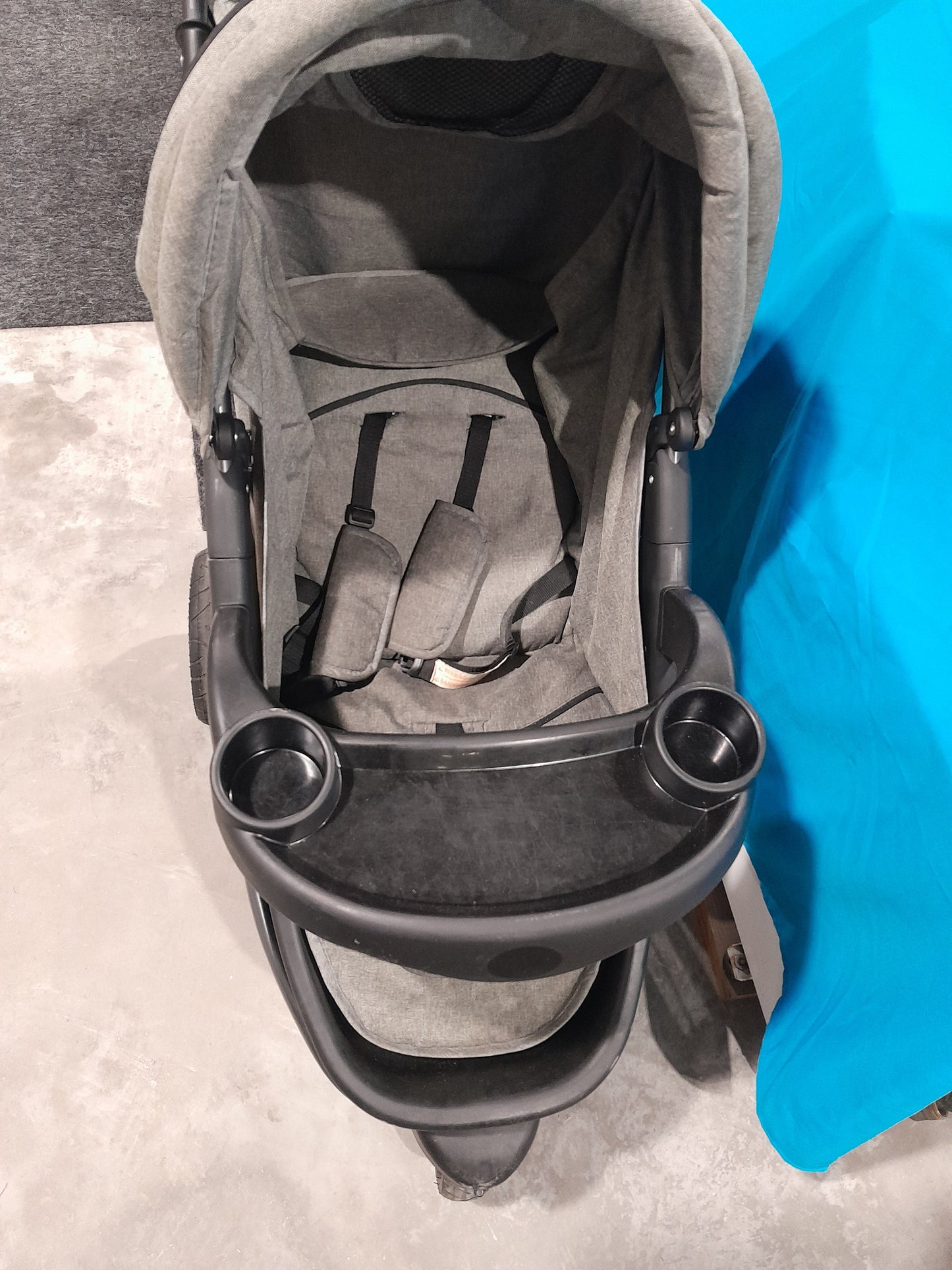 Little One baby stroller displayed in a secondhand store, ideal for parents seeking quality and safety.
