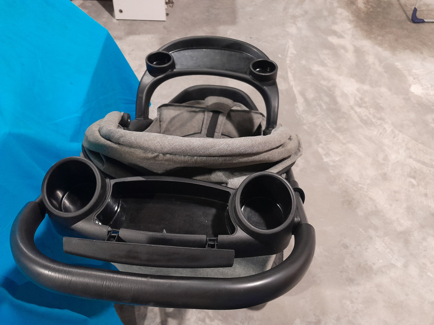 Little One baby stroller equipped with cup holders, designed for comfortable outings with your baby.