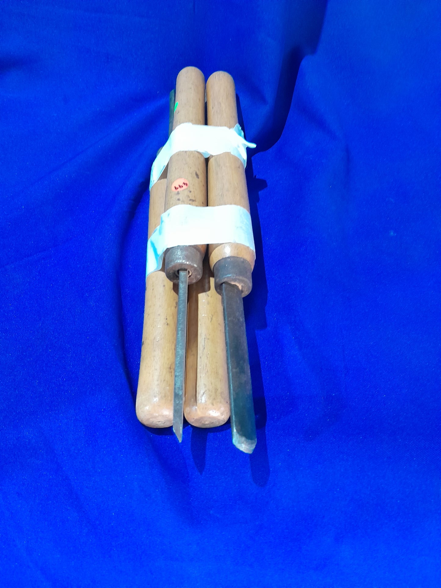 Carbon wood chisel set with black handles and sharp metal edges, priced at 50 each, perfect for woodworking tasks.