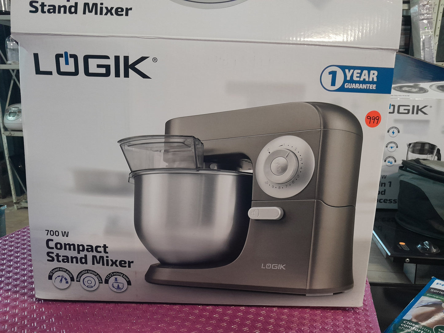 LOGIK Compact Stand Mixer, 700W power, with splash guard, 5L stainless steel bowl, and 10 speed settings plus pulse function.