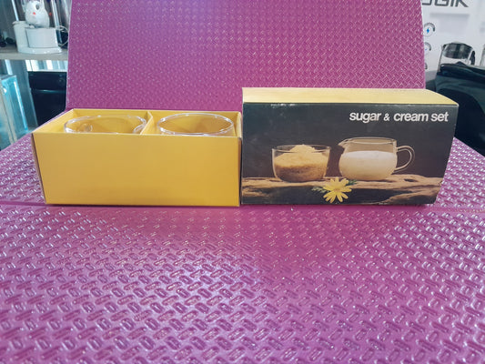 Vitria Sugar and Cream Set in durable toughened glass, includes one sugar bowl and one cream jug, perfect for serving.