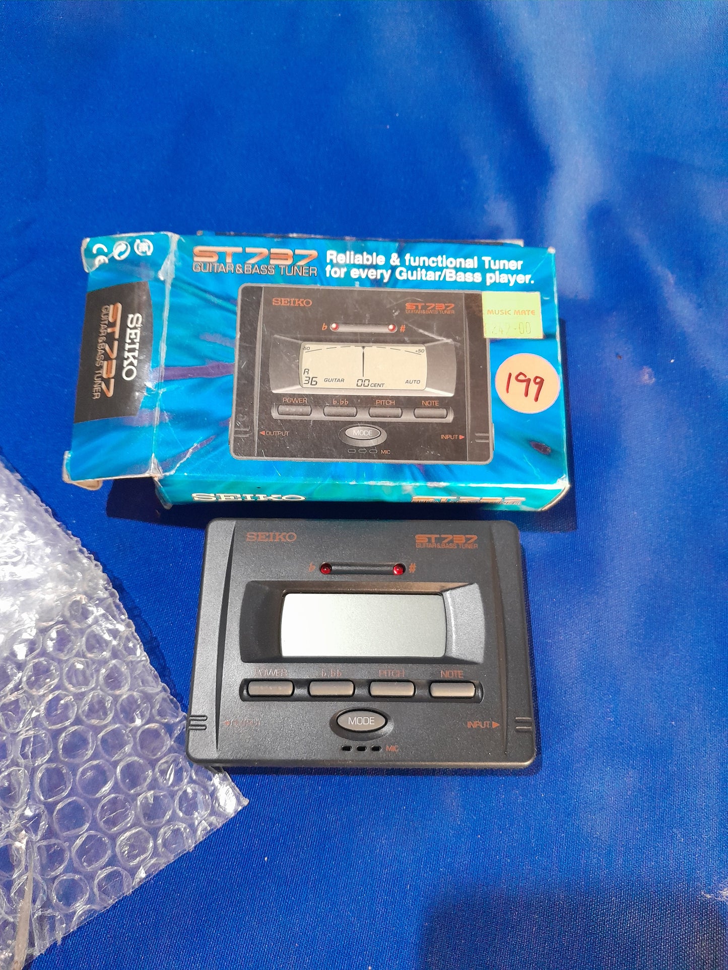 Seiko ST737 guitar and bass tuner, compact and reliable for musicians, featuring automatic and manual tuning options.