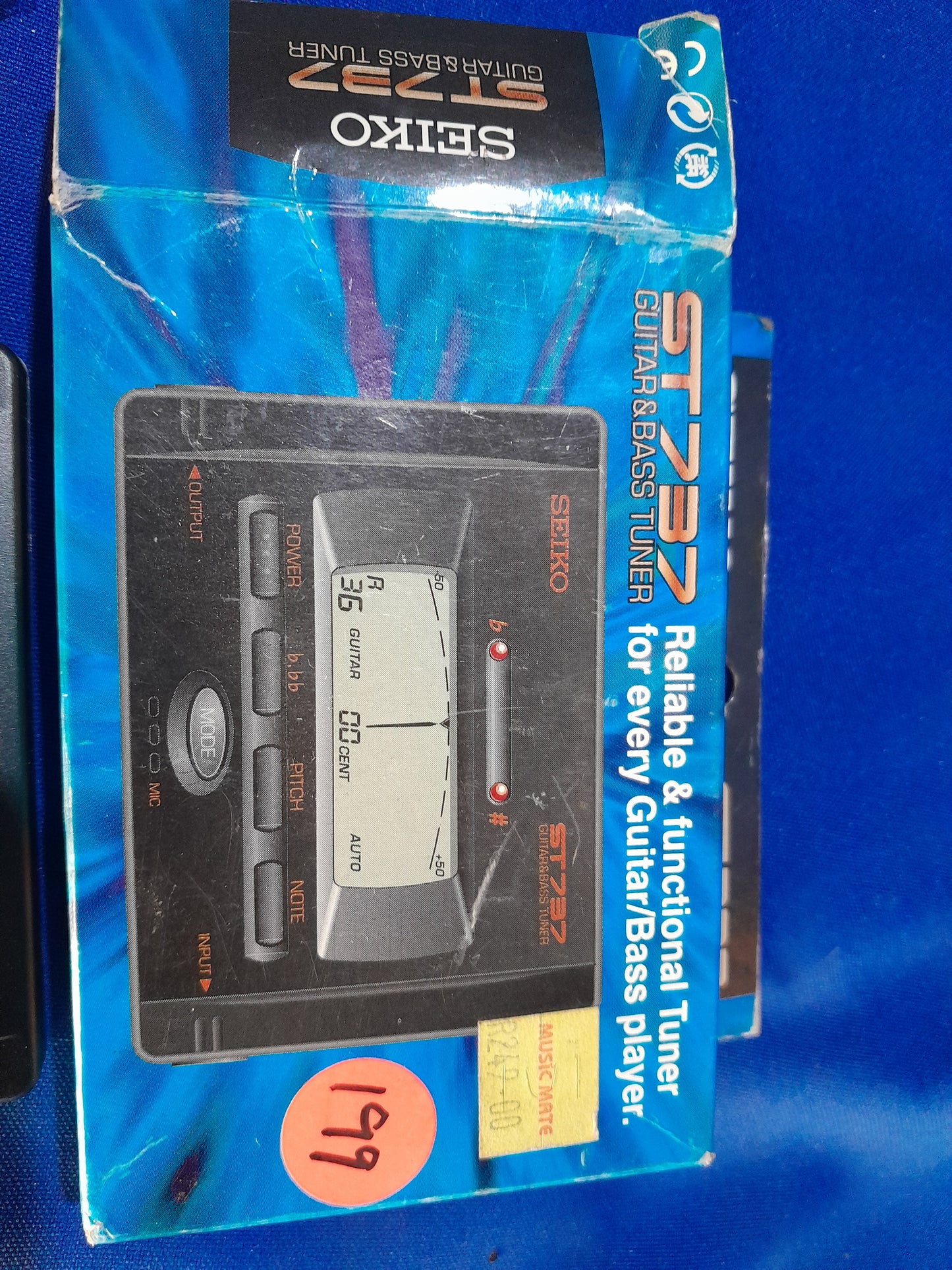 Packaging of Seiko ST737 guitar and bass tuner, ideal for guitarists and bassists seeking precision tuning.
