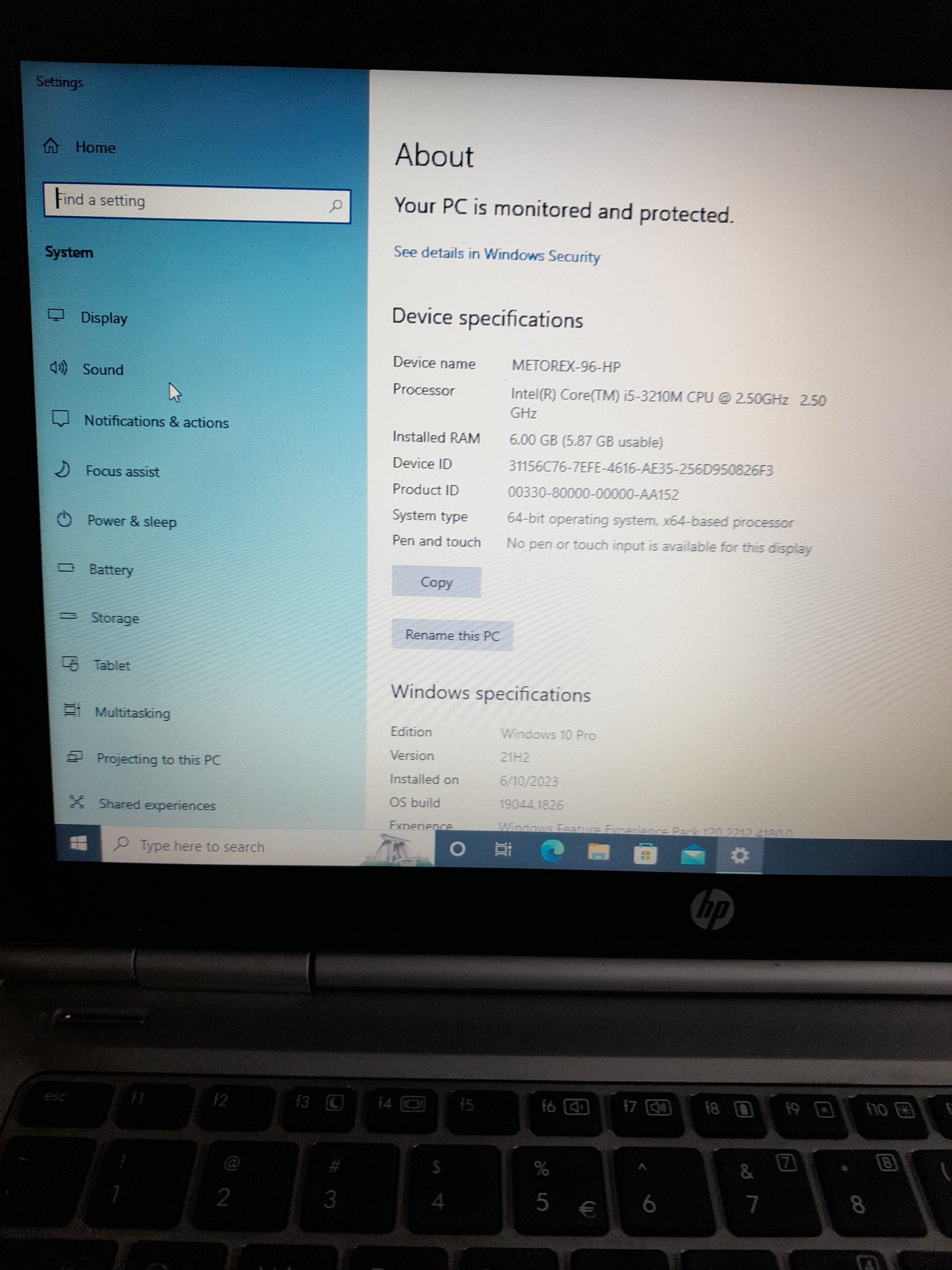 HP i5 laptop on display in secondhand store, a great deal for budget-conscious buyers
