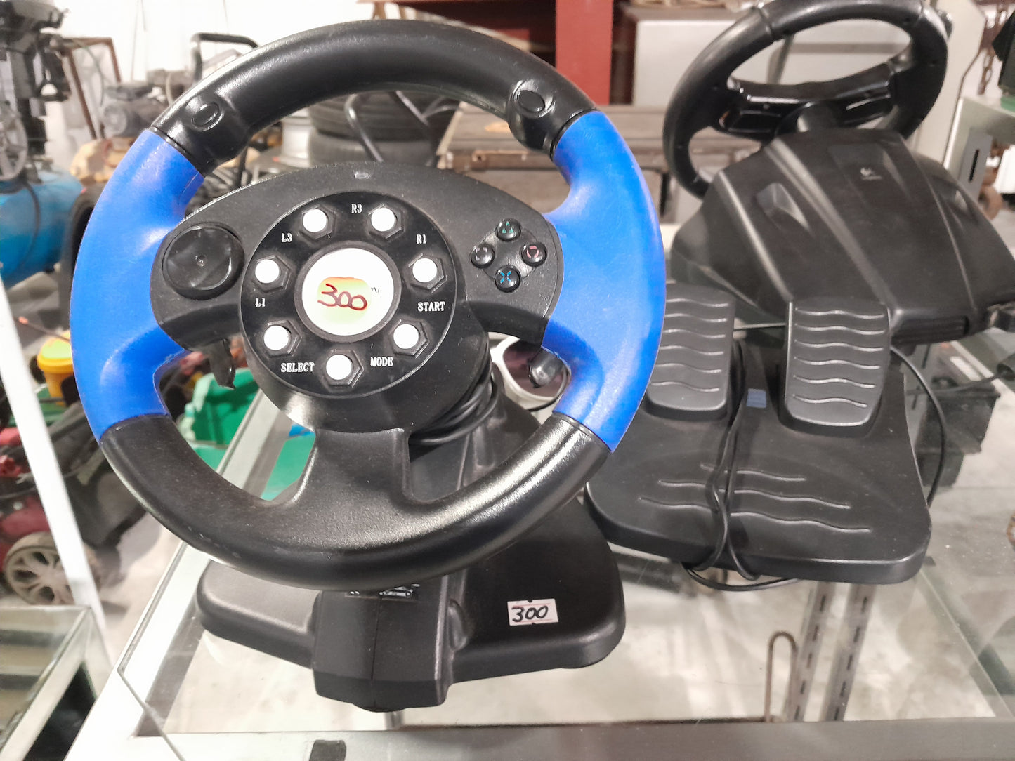 PlayStation 2 steering wheel and pedal combo, enhancing your gaming experience with realistic controls.