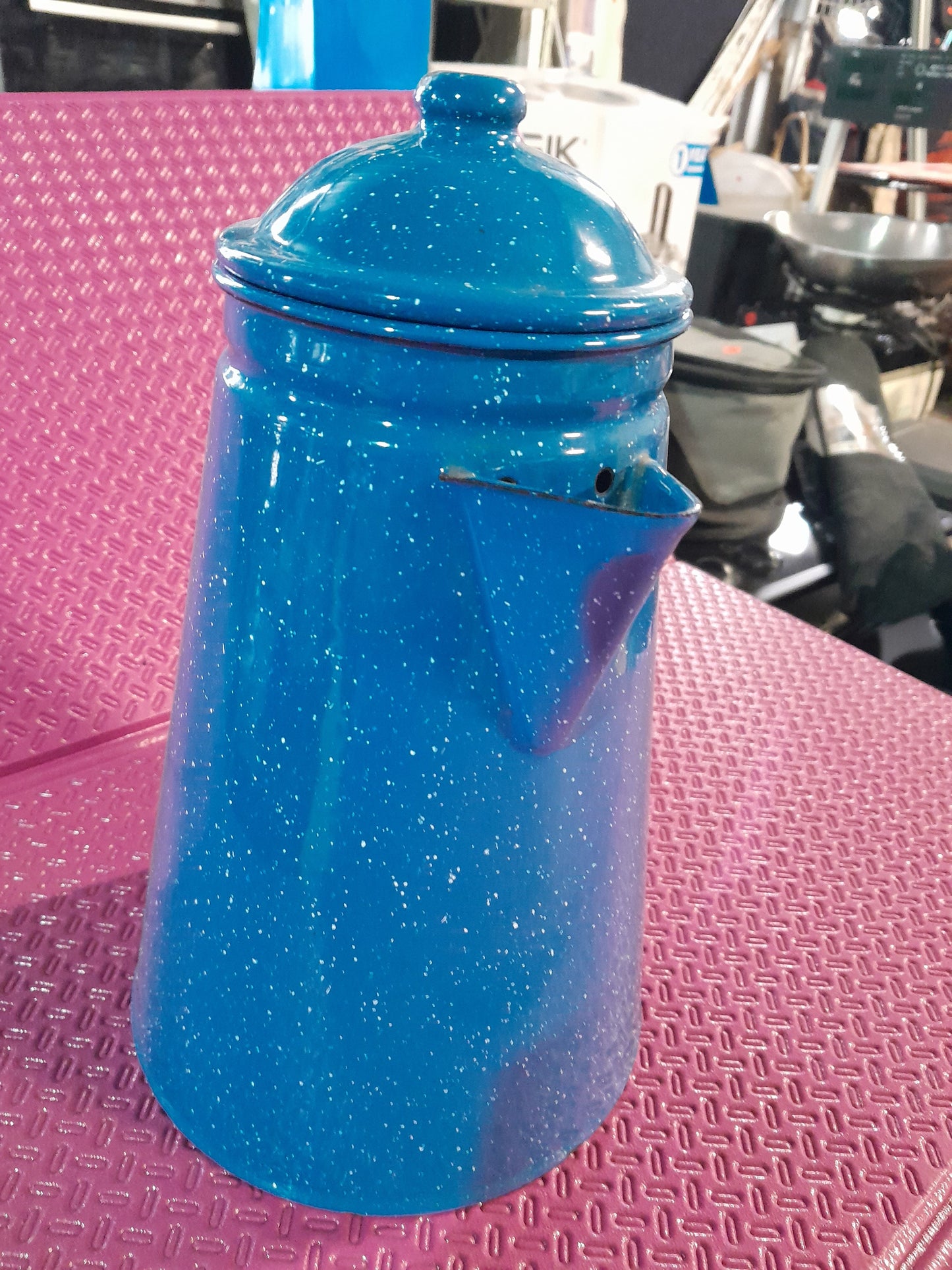 Charming vintage-style blue coffee pot, a great addition to any kitchen collection.