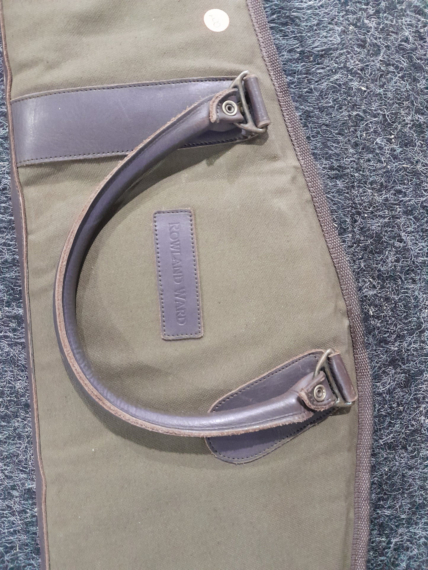 Display of a Roland Ward rifle bag, ideal for protecting firearms during transport or storage.