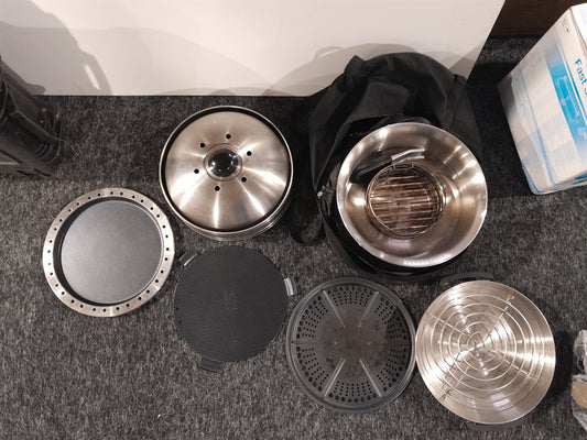 All-in-one outdoor Cobb kitchen cooker with various cooking components for versatile meals