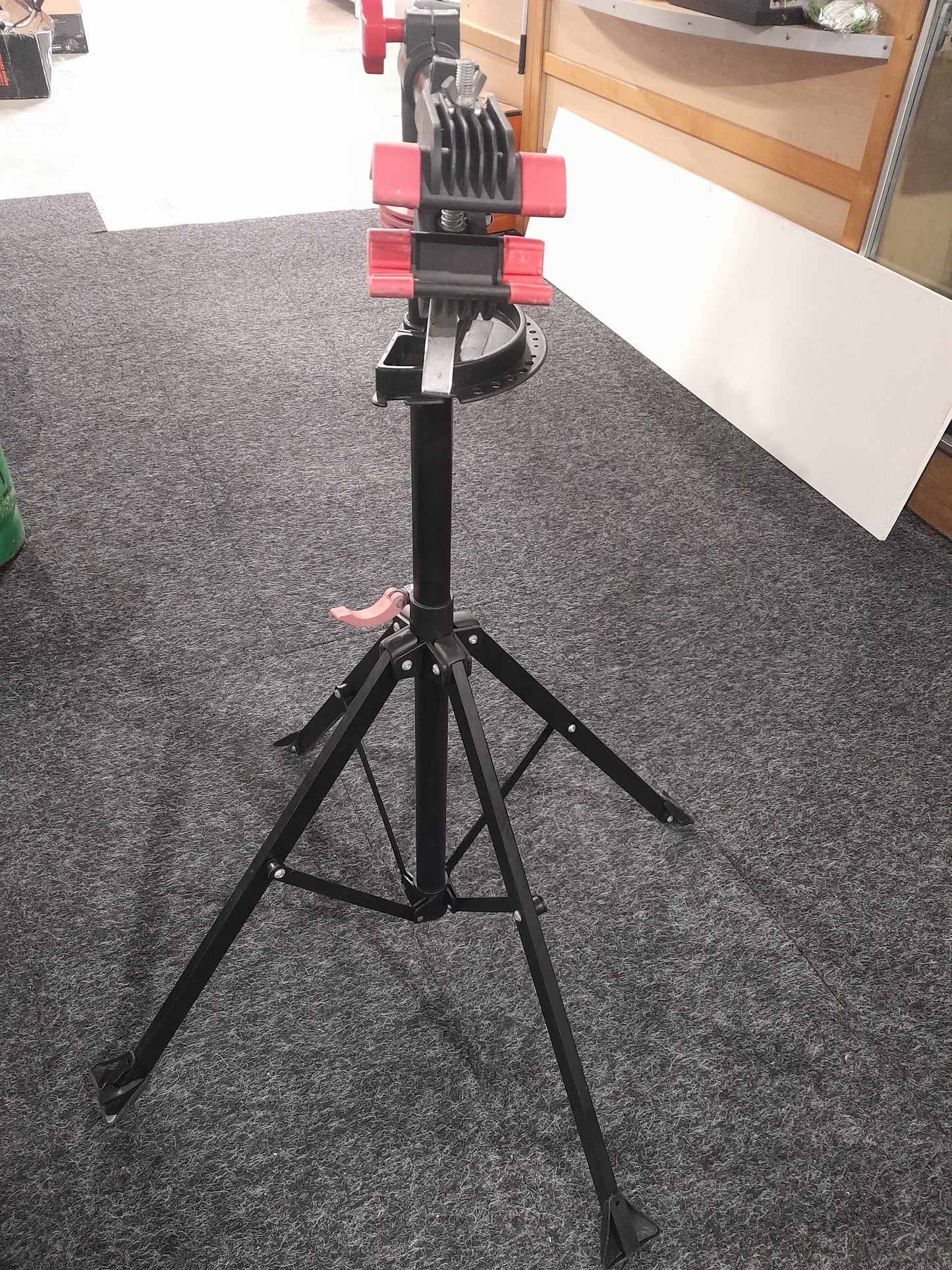 Compact and portable Tork Craft bicycle repair stand, essential for every bike enthusiast's home workshop.