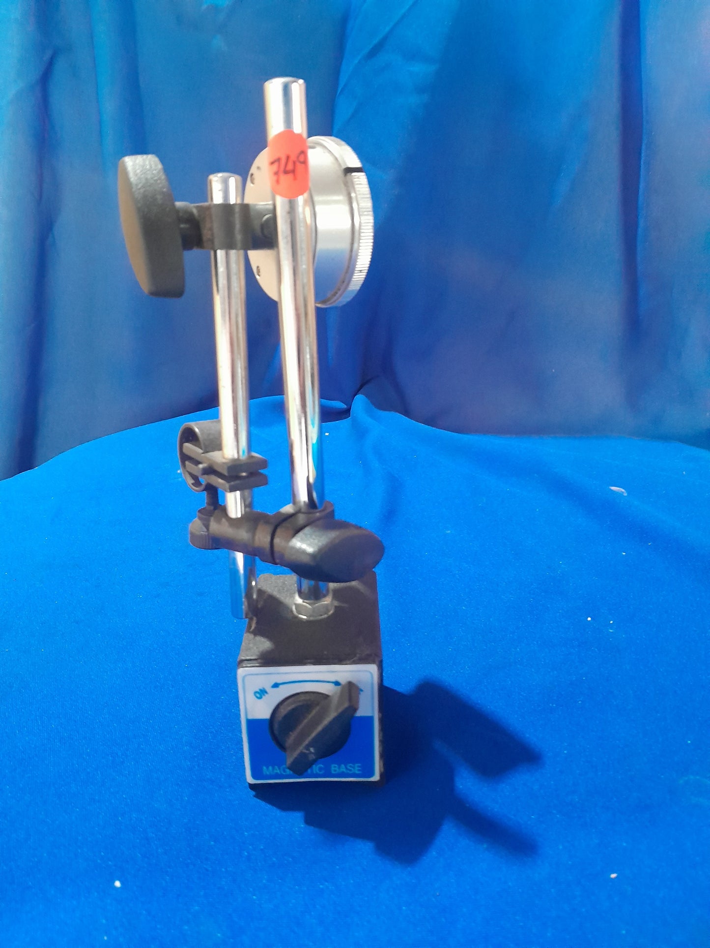 Detailed view of a magnetic dial indicator gauge, showcasing its sturdy design for reliable measurements.