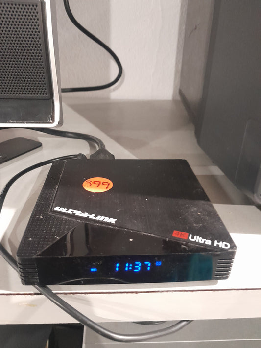 Ultra Link 4K Android TV Box with USB ports and time display, ideal for streaming.