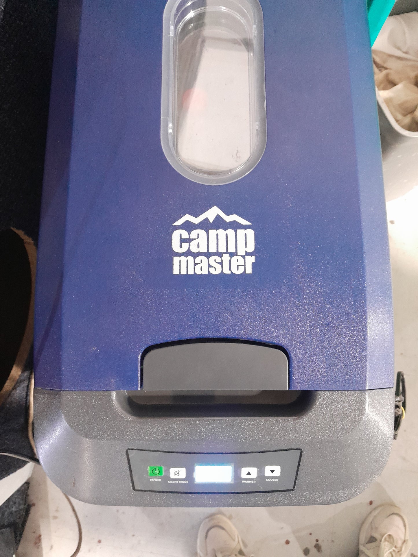 Camp Master 12 V Cooler Box featuring wheels for easy movement during outdoor adventures.