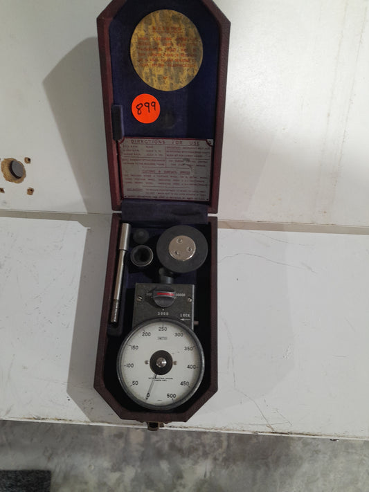 Vintage hand tachometer in open case, measuring rotational speed for precision tasks.