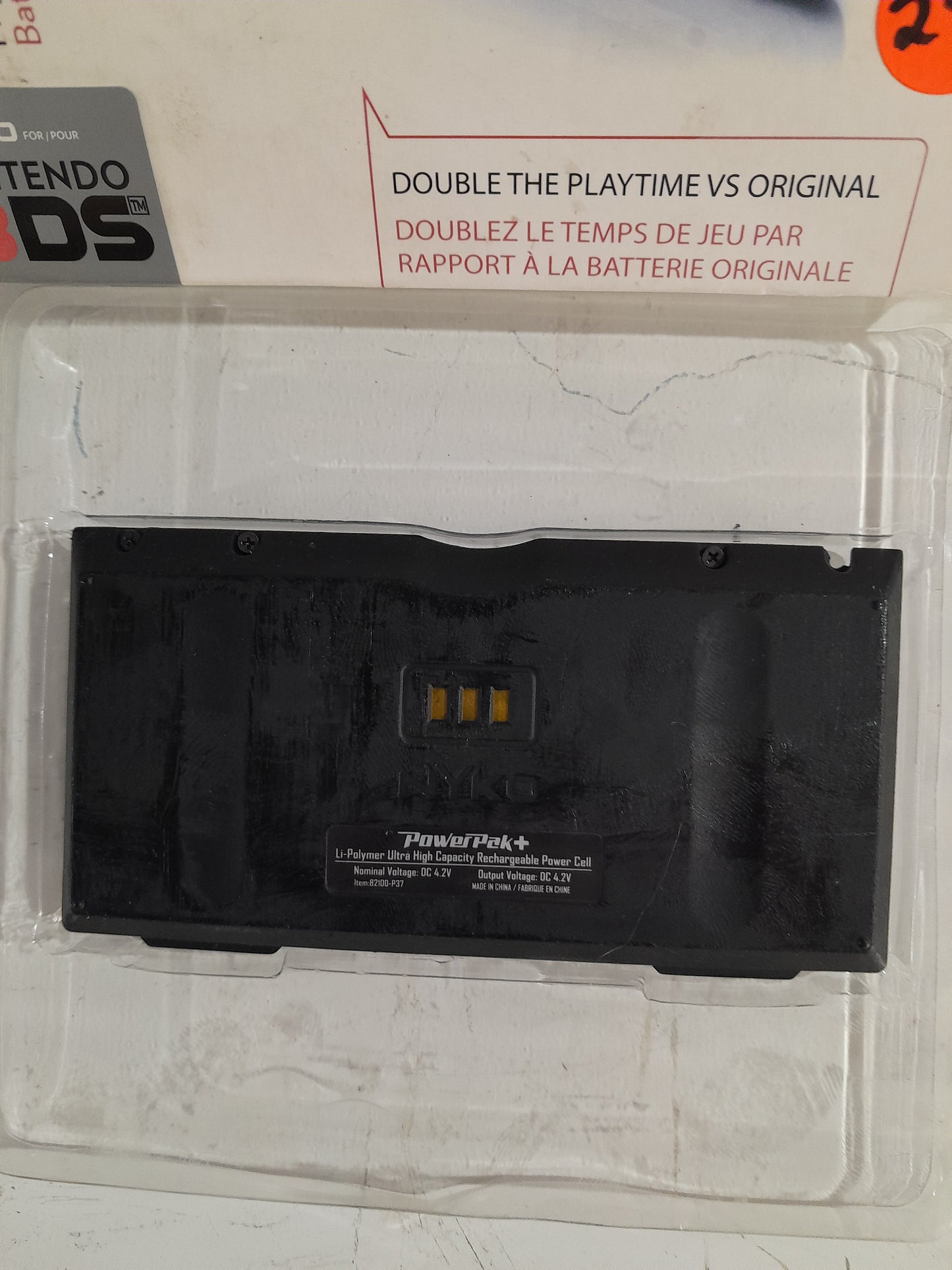 Nintendo Power Pak+ in its case, rechargeable battery for Nintendo 3DS consoles.