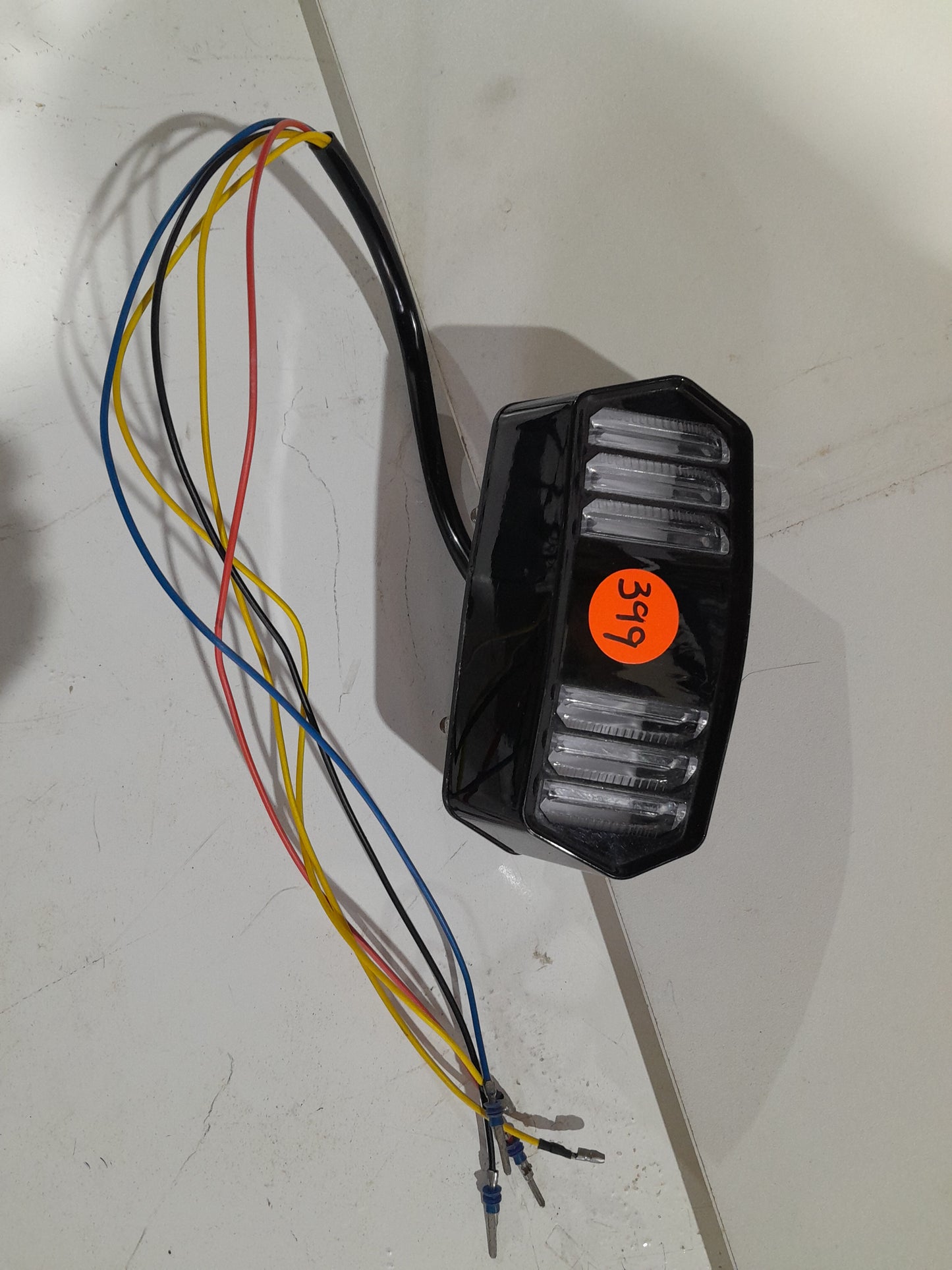 High-quality LED motorcycle tail light with integrated brake, running, and turn signal features.