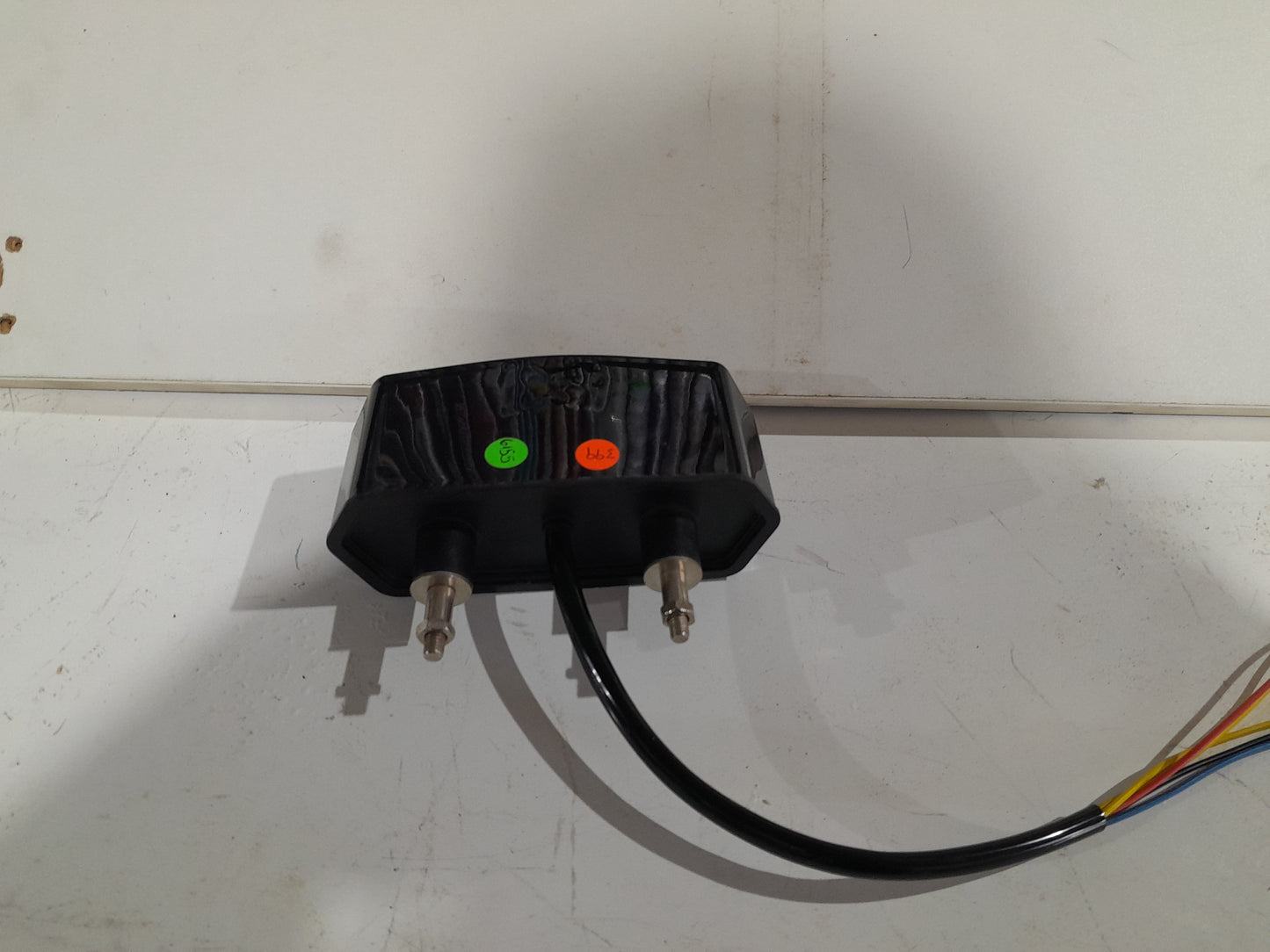 Compact motorcycle LED tail light designed for easy installation and enhanced visibility on the road.