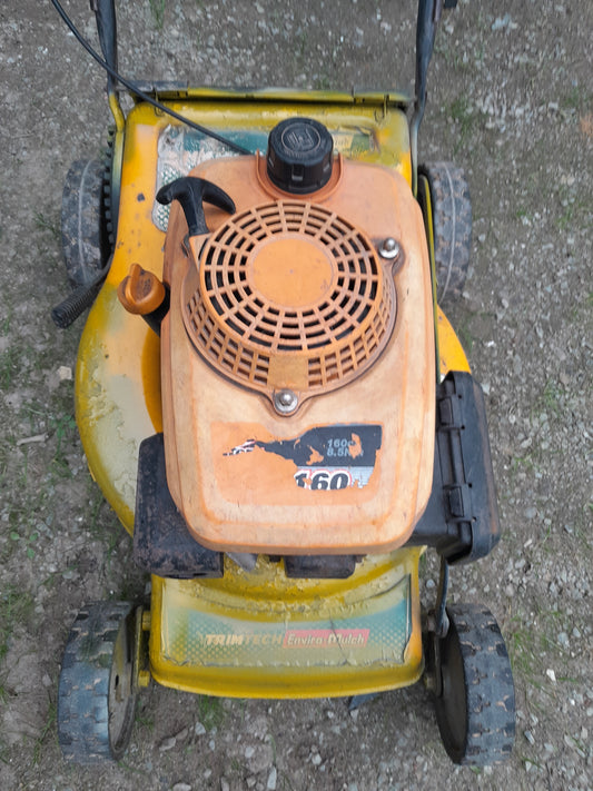 Top view of the Trimtech XT 160 petrol lawnmower showcasing its 160cc engine and design.